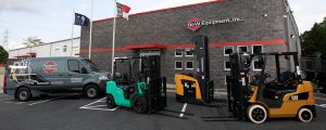 Forklifts and service van outside of G&W Equipment location