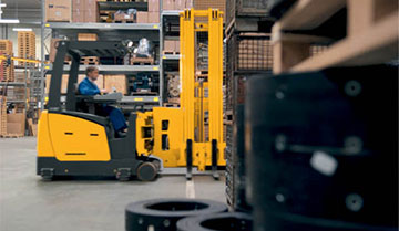 Jungheinrich driver turret truck moving warehouse material