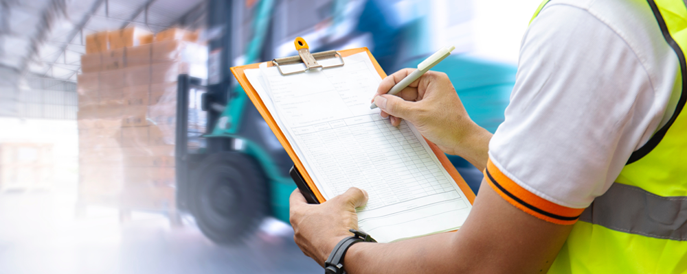 Warehouse worker reviewing checklist