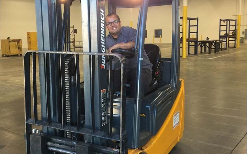 Kenny on a forklift_